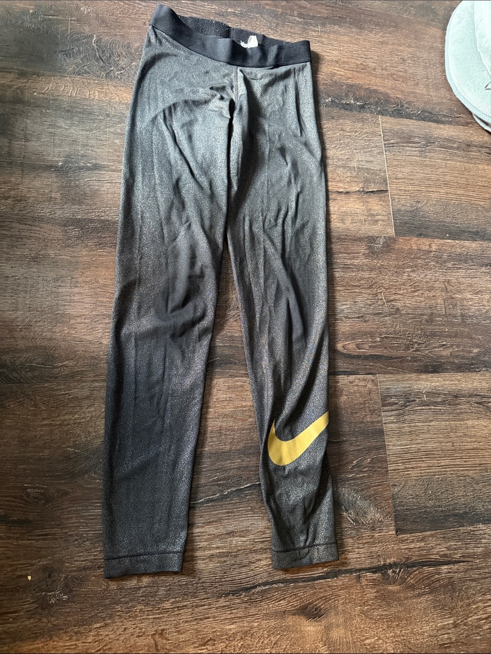Nike Black Leggings with Gold Swoosh Accent